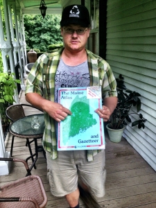 pointing to Moosehead Lake on the cover of the Gazetteer.